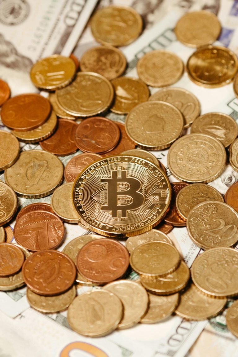 Bitcoin on Golden Coins Pile